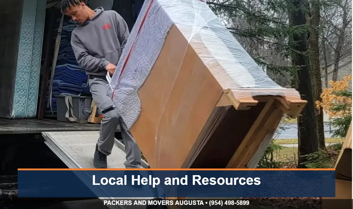 Movers wrapping furniture with blankets during a discounted Augusta move